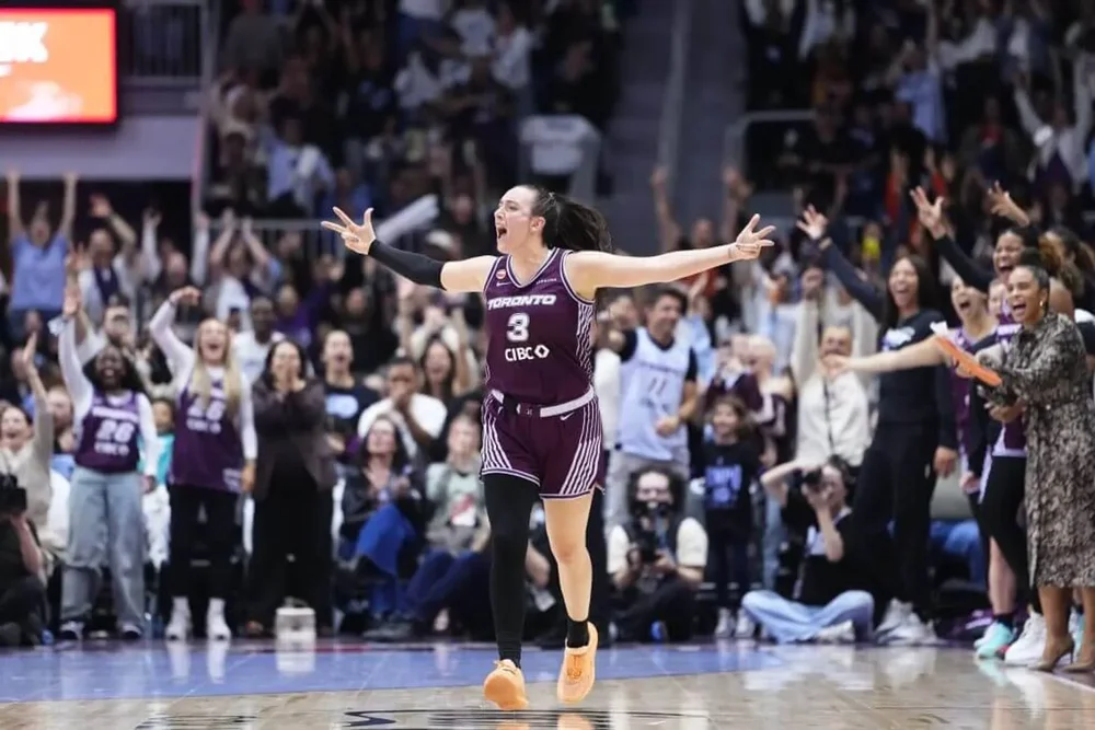 Tempo guard Marina Mabrey spreads her arms as she jogs down Toronto's court in the team's first game.