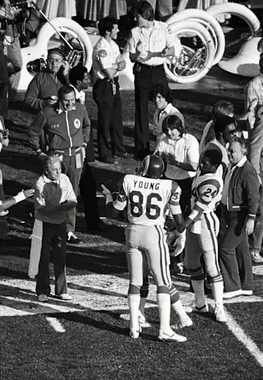 Los Angeles Rams tight end Charle Young (86) on the sideline with linebacker Joe Harris (51) and running back Eddie Hill (24) during Super Bowl XIV against the Pittsburgh Steelers at the Rose Bowl. The Steelers defeated the Rams 31-19.